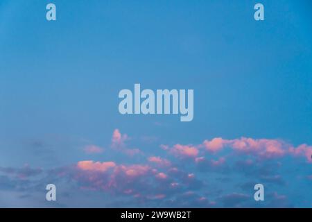 Beautiful multicolored sky after sunset, Used for background. nature sea sky with pink clouds sea voyage walk. Beautiful shot of pink clouds in a clea Stock Photo