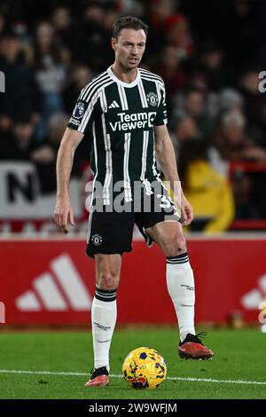 Nottingham, UK. 30th Dec, 2023. Jonny Evans of Manchester United during the Premier League match Nottingham Forest vs Manchester United at City Ground, Nottingham, United Kingdom, 30th December 2023 (Photo by Craig Thomas/News Images) Credit: News Images LTD/Alamy Live News Stock Photo