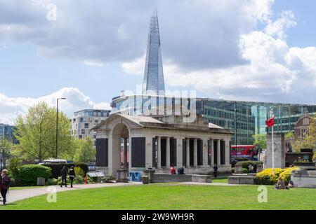 Tower Hill, London - April 30th 2015: The Trinity Square Gardens with the Tower Hill Memorials and Shard building in the background. Stock Photo