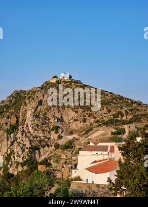 View over Nikia Village towards the hill with Prophet Elias Church, Nisyros Island, Dodecanese, Greece Stock Photo