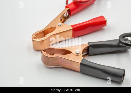 copper terminals for charging a car battery closeup on white Stock Photo