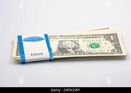 stack of one dollar bills in bank packaging closeup on white Stock Photo