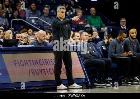 South Bend, Indiana, USA. 30th Dec, 2023. Virginia head coach Tony Bennett directs the offense during NCAA basketball game action between the Virginia Cavaliers and the Notre Dame Fighting Irish at Purcell Pavilion at the Joyce Center in South Bend, Indiana. Notre Dame defeated Virginia 76-54. John Mersits/CSM/Alamy Live News Stock Photo