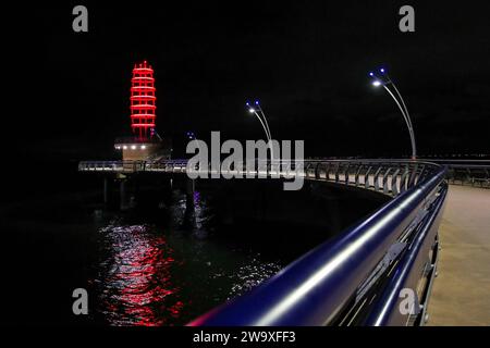 Burlington Ontario Canada, Oct 14th 2023. The Brant Street Pier at night with red and blue lights. Luke Durda/Alamy Stock Photo