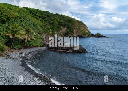 The open road of Piilani Highway offers breathtaking views of the rolling hills along Maui's south coast. Stock Photo