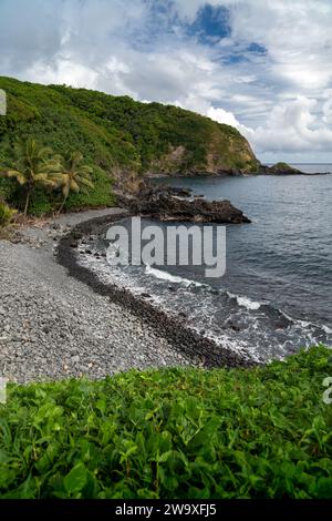 The open road of Piilani Highway offers breathtaking views of the rolling hills along Maui's south coast. Stock Photo