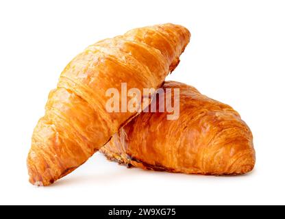 Front view of delicious croissants in stack or cross shape is isolated on white background with clipping path. Stock Photo