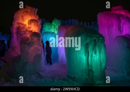 The Ice Castle in Cripple Creek Colorado. Tons of ice and colored lights in the ice castle. There are adult and children's slides. There are tunnels Stock Photo