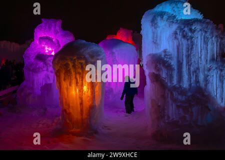 The Ice Castle in Cripple Creek Colorado. Tons of ice and colored lights in the ice castle. There are adult and children's slides. There are tunnels Stock Photo