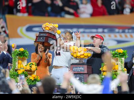 December 30, 2023:.Georgia Bulldogs running back Kendall Milton (2) lifts the MPV trophy after the Capital One Orange Bowl between the University of Georgia Bulldogs and the Florida State University Seminoles at Hard Rock Stadium in Miami Gardens, FL. Ron Lane/CSM Stock Photo