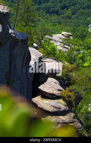 Layered rocks leading to the top of a cliff Stock Photo