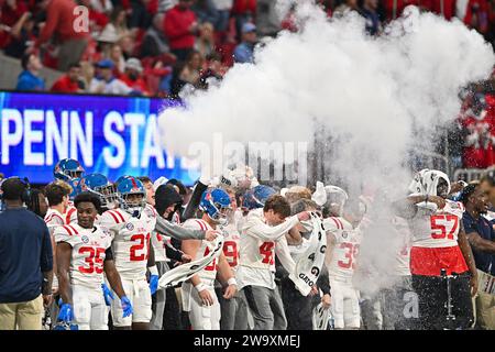 Atlanta, United States. 30th Dec, 2023. Mississippi players celebrate a score against Penn State during the first half of the Peach Bowl Saturday, Dec. 30, 2023, in Atlanta, Ga. Photo by David Tulis/UPI Credit: UPI/Alamy Live News Stock Photo