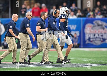 Atlanta, United States. 30th Dec, 2023. Penn State head coach James Franklin escorts a player from the field during the second half of the Peach Bowl against Mississippi Saturday, Dec. 30, 2023, in Atlanta, Ga. Mississippi won 38-25. Photo by David Tulis/UPI Credit: UPI/Alamy Live News Stock Photo