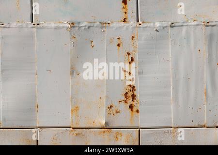 steel sheets patchwork painted gray with rust spots closeup full-frame background and texture Stock Photo