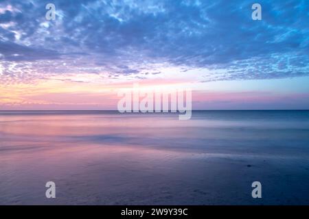 Stunningly vibrant and colourful pastel cloudy sunset over the ocean, taken in South Australia Stock Photo