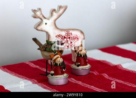 deer and candle new year concept on red background Stock Photo