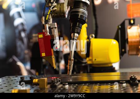 Automatic welding robot in a modern factory in operation.. Stock Photo