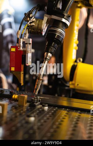Automatic welding robot in a modern factory in operation.. Stock Photo