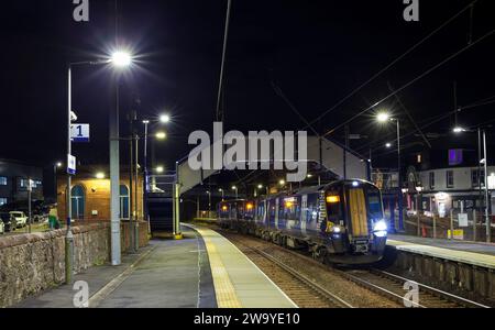 Scotrail Siemens class 380 electric train 380010 calling at Saltcoates (Ayrshire) railway station, Scotland, UK at night. Stock Photo