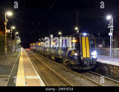 Scotrail Siemens class 380 electric train 380108 calling at Stevenston (Ayrshire) railway station, Scotland, UK at night. Stock Photo