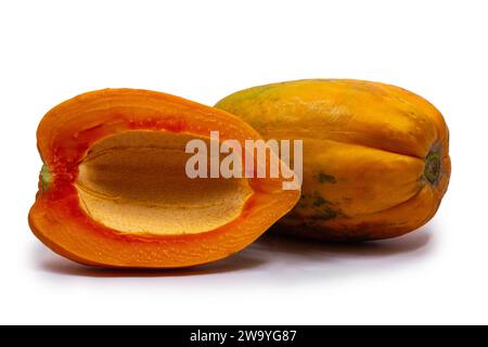 whole and half of ripe papaya fruit without seeds isolated on white background Stock Photo