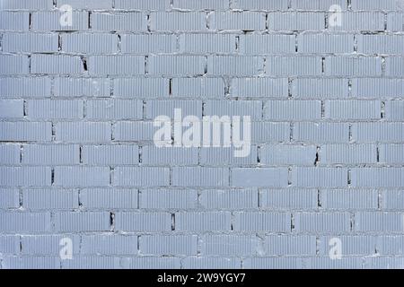 Background from a wall made of gray painted bricks Stock Photo