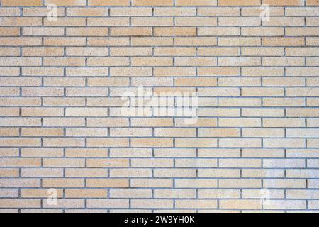 Background from a beige clinkered wall Stock Photo
