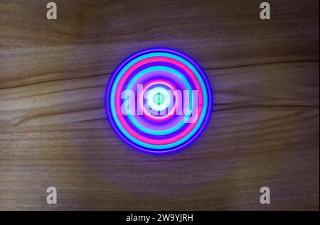 illusion maker of colorful light with blurred motion Stock Photo