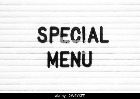 Black color letter in word special menu on white felt board background Stock Photo