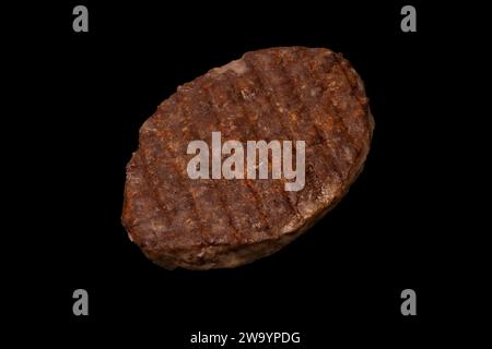 Cutlet with minced beef isolated on a black background. Stock Photo
