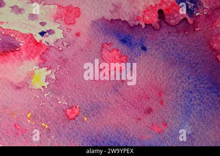 Watercolor, paint, abstraction. Close-up. Real Texture of watercolor paint on paper. Splashes of liquid paint. Stock Photo