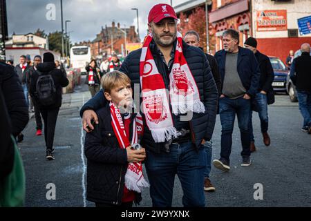 Father and son liverpool fc supporter an hour before kick-of at Anfield. Stock Photo