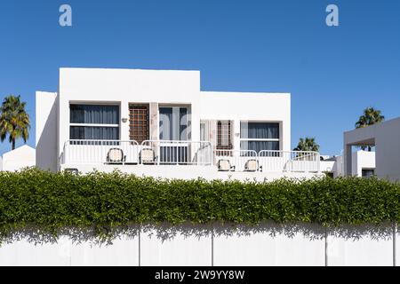 White villas in Middle East, on a background of blue sky. Holidays in luxury homes by the beach. Beautiful modern architecture of the building Stock Photo