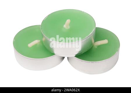 Green decorative tea light candles in aluminum holders stack isolated on white background Stock Photo