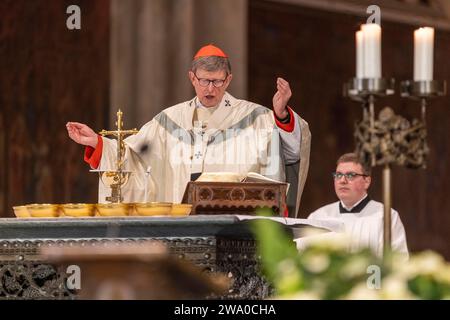 Cologne, Germany. 31st Dec, 2023. Cardinal Rainer Maria Woelki, Archbishop of Cologne, celebrates the end-of-year pontifical mass in Cologne Cathedral. Credit: Thomas Banneyer/dpa/Alamy Live News Stock Photo