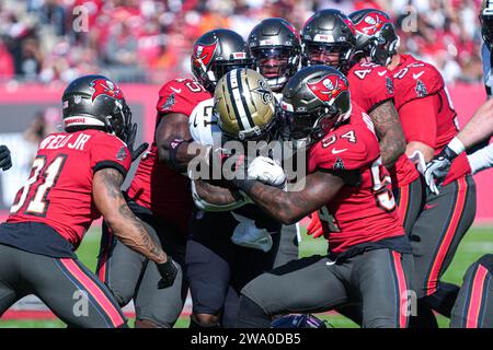 Tampa Bay, Florida, USA, December 31, 2023, New Orleans Saints running back Jamaal Williams #21 is tackled at Raymond James Stadium. (Photo Credit: Marty Jean-Louis/Alamy Live News Stock Photo