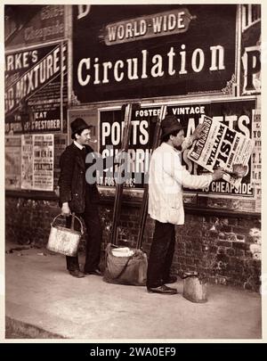 Street Advertising. John Thomson. 1876â€“77. Putting up a poster for Madame Tussauds. Woodburytype. Stock Photo