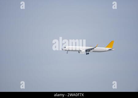 A cargo plane ascending with the landing gear deployed on a day with clear skies Stock Photo