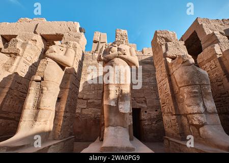 Luxor, Egypt - December 26 2023: Ramesses III Temple, Ramses statues at the Karnak Temple Stock Photo