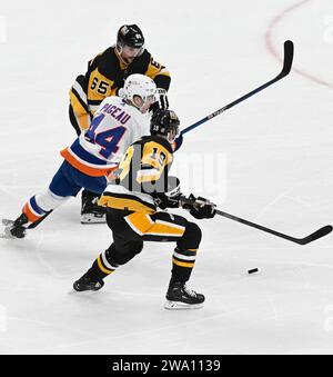 New York Islanders center Jean-Gabriel (44) dives for the puck in a ...