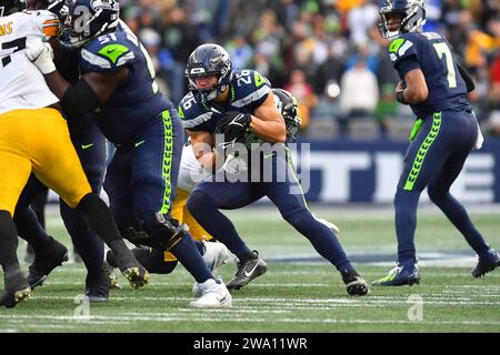 Seattle, WA, USA. 31st Dec, 2023. Seattle Seahawks running back Zach Charbonnet (26) picks up[ yards after a catch on the Seahawks final scoring drive during the NFL Football game between the Pittsburgh Steelers and Seattle Seahawks in Seattle, WA. Pittsburgh defeated Seattle 30-23. Steve Faber/CSM (Credit Image: © Steve Faber/Cal Sport Media). Credit: csm/Alamy Live News Stock Photo