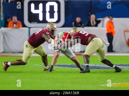 Georgia quarterback Gunner Stockton (14) runs from Notre Dame defensive ...