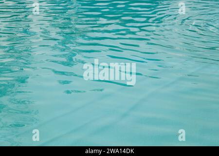 Blue ripped sea water as swimming pool. Crystal clear ocean lagoon bay turquoise blue azure water surface, closeup natural environment. Tropical Medit Stock Photo