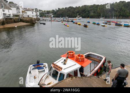 Autumn 2023, Fowey in Cornwall England small ferry boat that goes across the harbour to the village of Polruan, England,UK Stock Photo