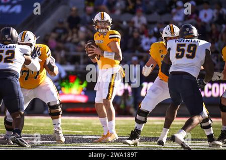 Wyoming Cowboys quarterback Andrew Peasley (6) looks down field in the first quarter of an NCAA college football game against the Wyoming Cowboys in T Stock Photo