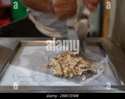 Artisan Ice Cream Expert Making Rolled Ice Cream Delicacy Stock Photo