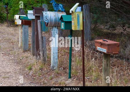 Mailboxes, often quirky and home-made,  form a row at Fryerstown, Central Goldfields, Victoria Stock Photo