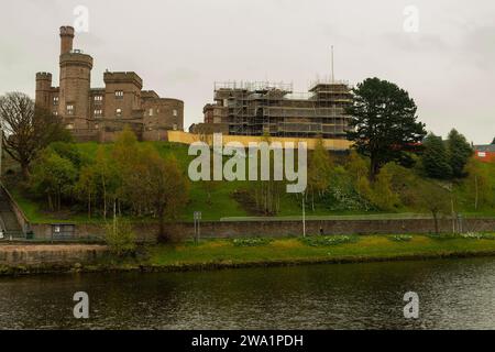 Looking over the River Ness in Inverness (Inbhir Nis) up at Inverness Castle. It is partly covered by scaffolding, whilst the planned transformation f Stock Photo
