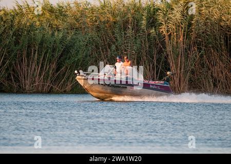 two people sailing on the river Ebro, Ebro Delta, Catalonia, Spain Stock Photo