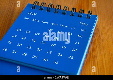 May 2024 Calendar on wooden desk. . High quality photo. Stock Photo